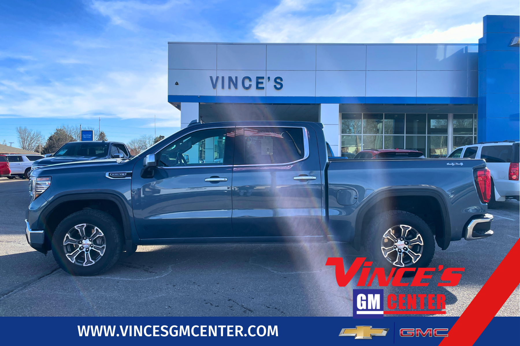 2024 GMC Sierra 1500 SLT in Downpour Metallic — front three-quarter view