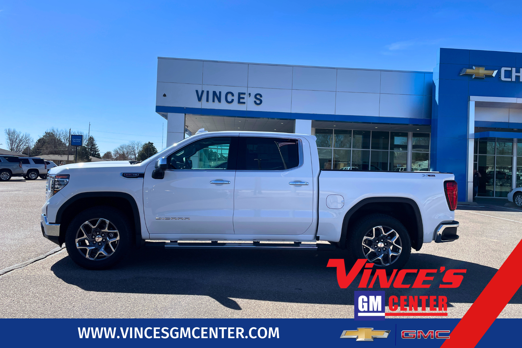 2026 GMC Sierra 1500 SLT in Summit White — front three-quarter view